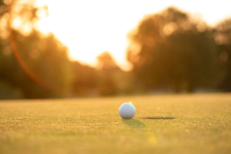 Golf ball, course on a sunny dayの写真素材