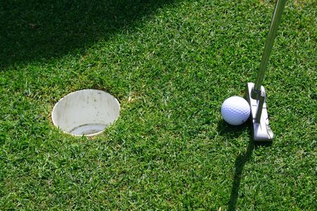 Short putt in a holeの写真素材