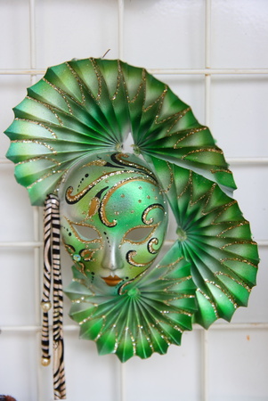 venetian masks hanging on a wallの写真素材