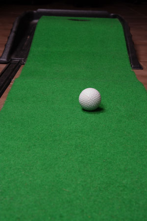Office golf - golf ball on artificial grass