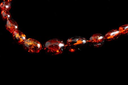 Amber necklace on black backgroundの写真素材