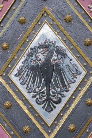 Moravian national emblem on gotic church door

の写真素材