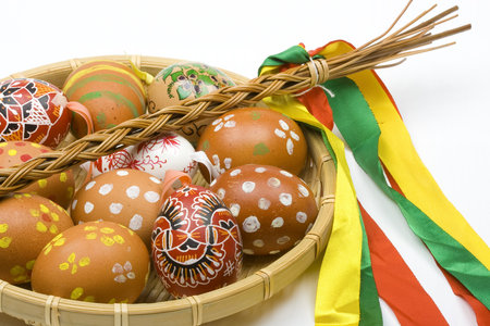 hand painted Easter eggs in scuttle isolated on black background

