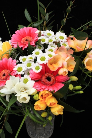 Bunch of many different flowers on black backgroundの写真素材