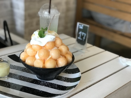 Profile portrait of sporty teen girl drinking clear water with closed eyesの写真素材