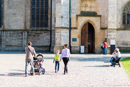 KUTNA HORA, CZECH REPUBLIC - MAY 21, 2017: The tourists in front of entrance to the Saint Barbara's Church.のeditorial素材