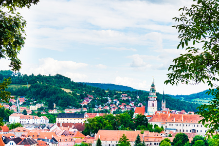The castle Cesky Krumlov in center of city. The view framed by a trees.のeditorial素材