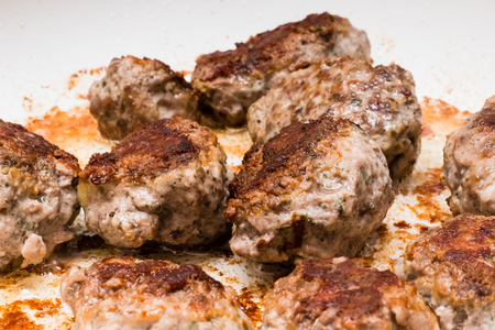 Meat balls of minced beef and pork on frying pan when cooking.の写真素材