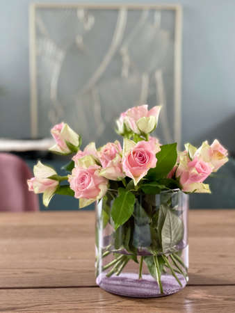 bouquet of pink roses on a wooden tableの写真素材