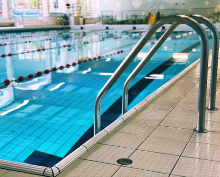 ladder in an indoor swimming poolの写真素材