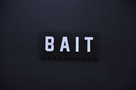 SAN DIEGO/CALIFORNIA, AUGUST 17, 2017: Bait logo on the dark wall.のeditorial素材