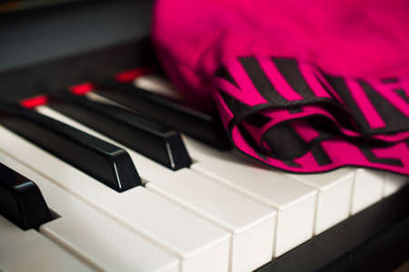 KRUPKA/CZECH REPUBLIC - 10/14/2017: Detail of the pink Calvin Klein Boxer Shorts on the piano keyboard.のeditorial素材