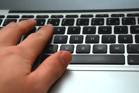 The hand of businessman/professional typing on the laptop keyboard. Theme for business, startup or a...