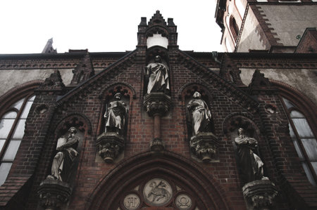the portal of a church in dark side of the building in dark and mystery atmosphere.