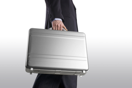 Businessman with suitcase on a white backgroundの写真素材