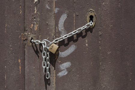 Old door with metal lockの写真素材