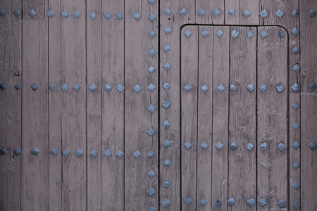 Part of old wood door with locksの写真素材