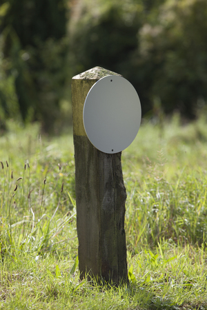 Blank Wooden Signpost In A Rural Landscapeの写真素材