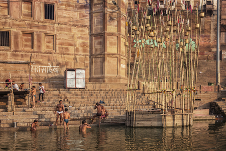 Unidentified people visit Ganges river ghat in Varanasi, Indiaのeditorial素材