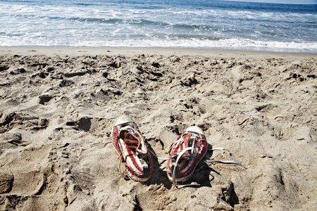 Forgotten shoes on the beach