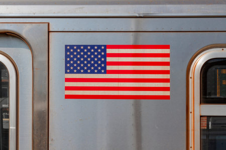 subway line in New York City with the flag of the USA