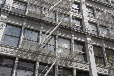 Exterior fire escape stairs on the outside of an old brick building. New Yorkの写真素材