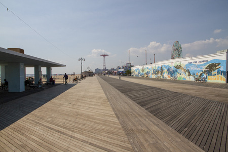 people visit famous old promenade at Coney Island, the amusement beach zone of New York, USAの写真素材