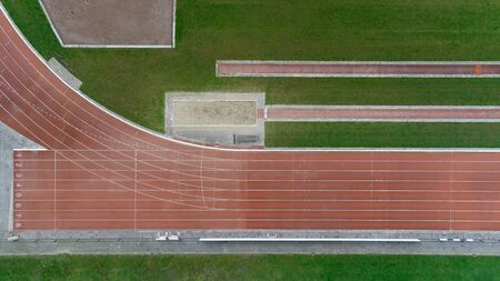 Athletics running track. Abstract aerial view looking down onto an athletics running track setの写真素材