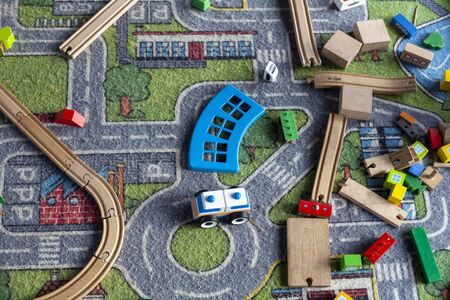 pack of colorful child kidâs education toys constructor train pattern background on the bright color background close up. Childhood education play infancy children baby conceptの写真素材