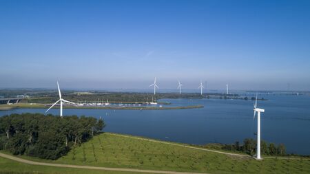 Wind turbine from aerial view, Drone view at windpark krammersluizen a windmill farm in the lake grevelingen in the Netherlands,Sustainable development, renewable energyの写真素材