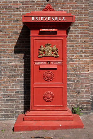 Vintage Red Mailbox in Netherlandsの写真素材