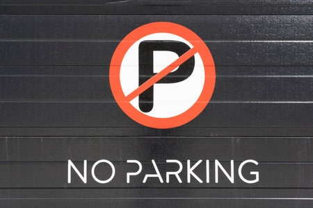 no parking traffic sign on black garage doorの写真素材