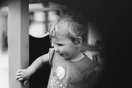 Little girl playing. Monochrome portraitの写真素材