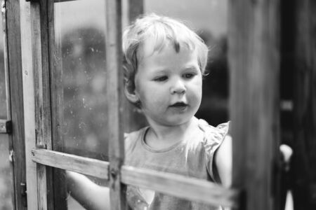 Little girl playing. Monochrome portraitの写真素材