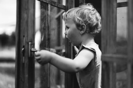 Little girl playing. Monochrome portraitの写真素材