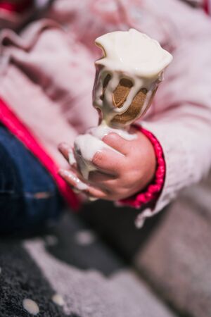 Detail of ice cream holding by little girlの写真素材