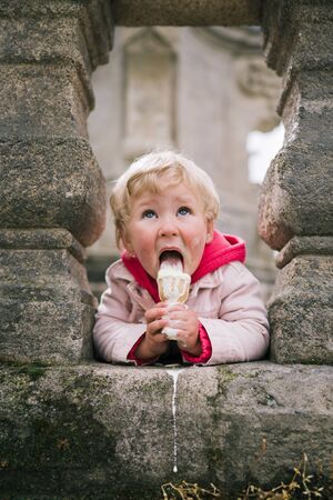 Portrait of little girl with ice creamの写真素材