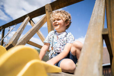 Little boy playing on playgroundの写真素材