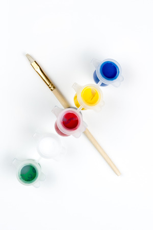 Capital letter X made up of tempera paints and brushの写真素材