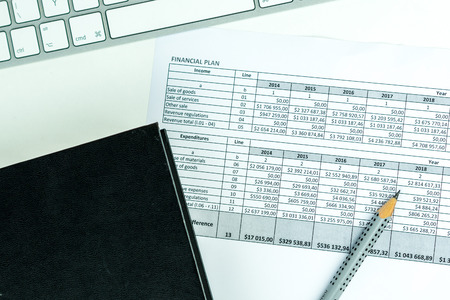 business concept, keypad, pencil and blank book on the tableの写真素材