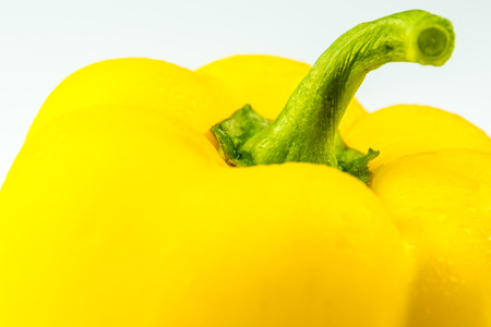closeup of yellow pepper on white backgroundの写真素材