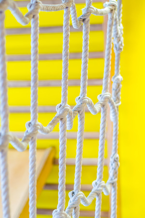 network of ropes in indoor children's playground, little gymの写真素材