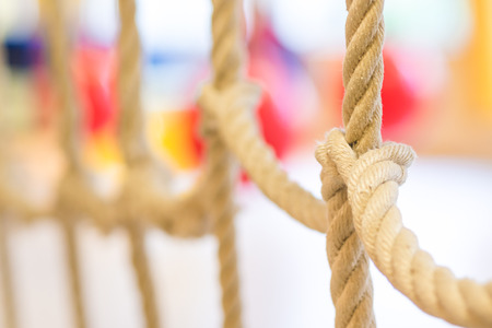 network of ropes in indoor children's playground, little gymの写真素材