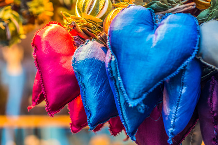 aromatic and multicolored decoration stand in chritsmas market, bunch of heartsの写真素材