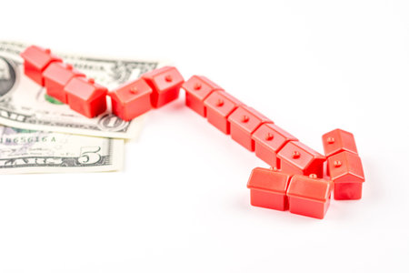 chart pattern made of miniatur red houses is falling, business conceptの写真素材