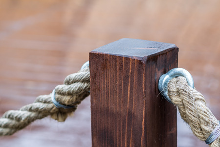 fence made of cord and wooden pierの写真素材