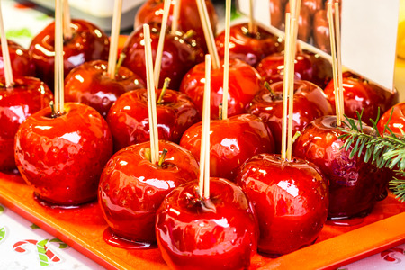red apples dip in honey on Christmas marketの写真素材