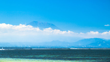 view of a volcano in bali from sanurの写真素材