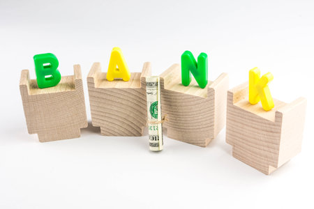 bank concept, capital letters of BANK on wooden piecesの写真素材