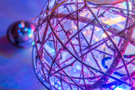 abstract christmas tree and ball decorated with bright lights and butterfliesの写真素材